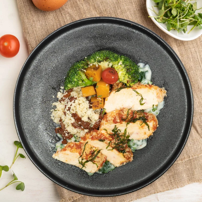 A. Slow Cooked Tuscan Style Chicken Breast W/ Roast Vegetables And Pumpkin Couscous Mix Rice