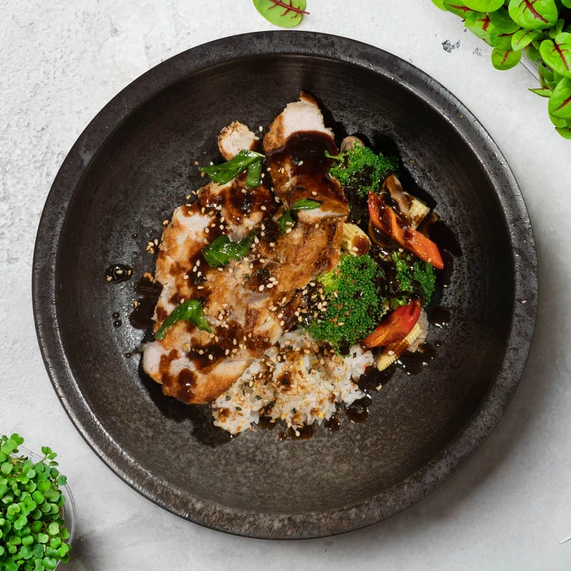 A. Japanese Lean Pork Tonkatsu W/ Sautee Vegetables, Ginger Pickles and Pearl Rice