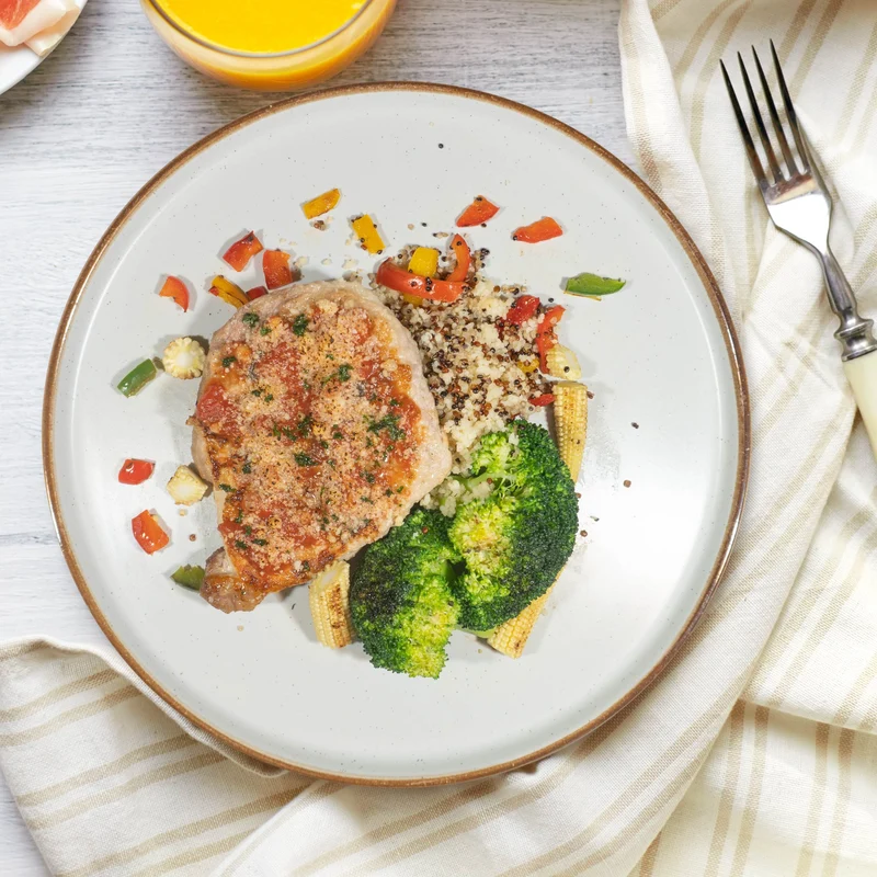A. Oven Baked Pork Loin Milanese Served W/ Roast Vegetables And Italian Quinoa Cous Cous Mix Rice