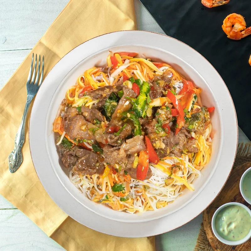 A. Saigon Shaking Beef W/ Stir Fry Vegetables And Rice Noodles