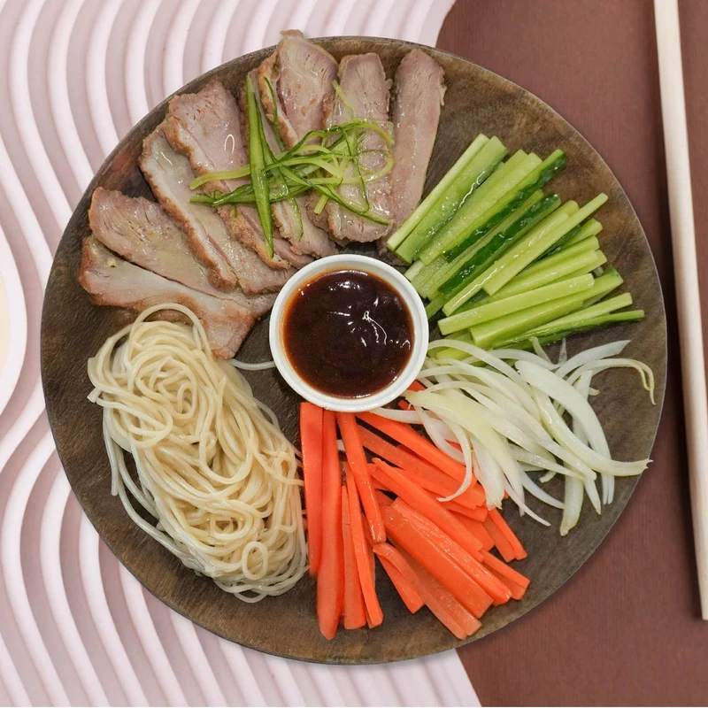 D. Healthy Peking Duck W/ Seasonal Vegetables and Asian Noodles