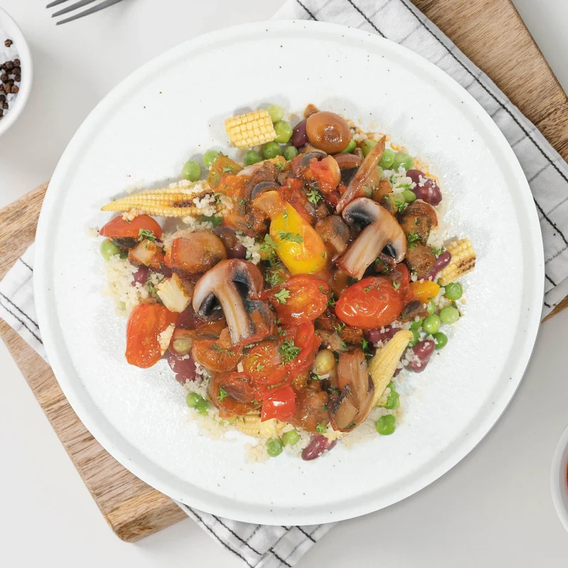 A. Spanish Mushroom and Chickpea Paella W/ Seasonal Vegetables And Quinoa Mix Cous Cous Rice
