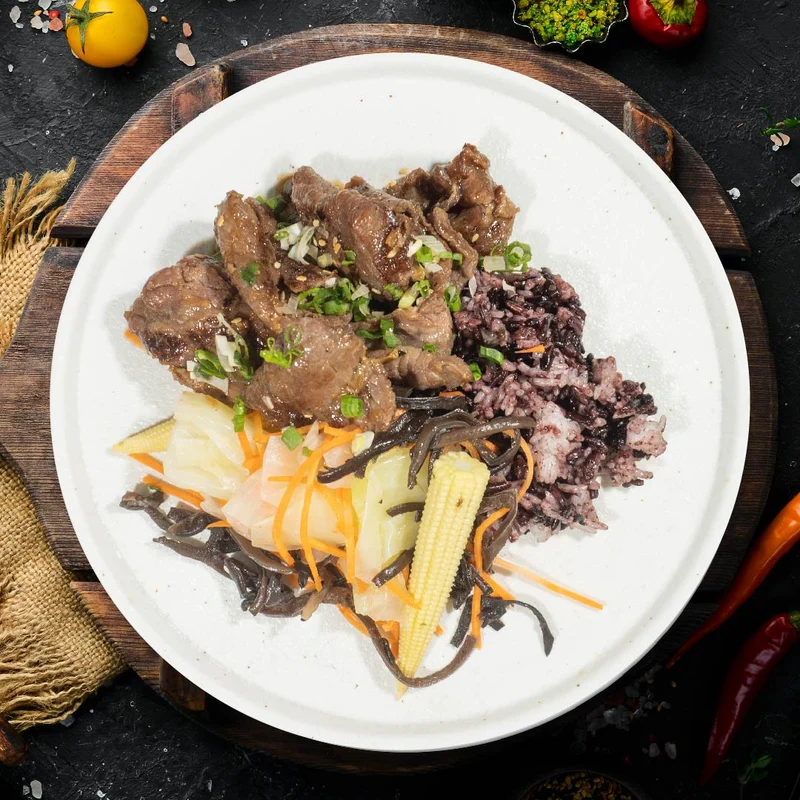 B. Korean Beef Bulgogi W/ Assorted Stir-Fry Vegetables And Purple Grain Rice