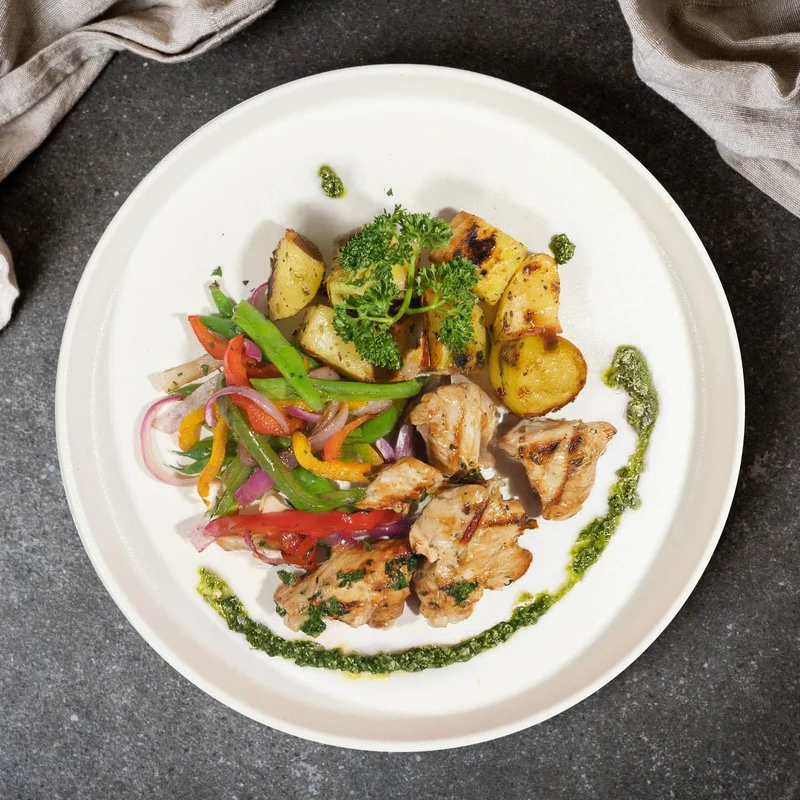 A. Grilled Chicken W/ Garlic Potatoes, Garden Vegetables And Pesto Sauce