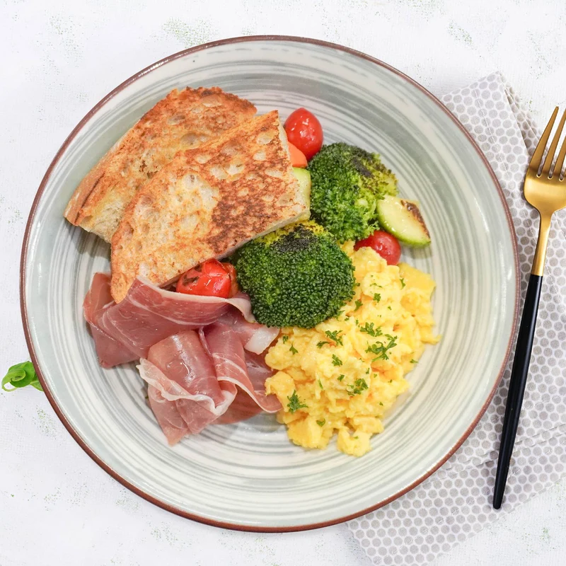 Scrambled Eggs W/ Parma Ham, Roasted Vegetables And Wheat Bread