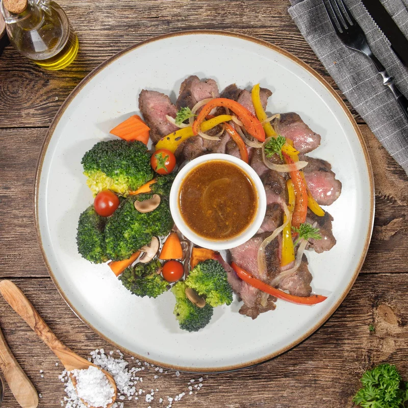 Grass Fed Ribeye Steak W/ Sauteed Vegetables And Peppercorn Sauce